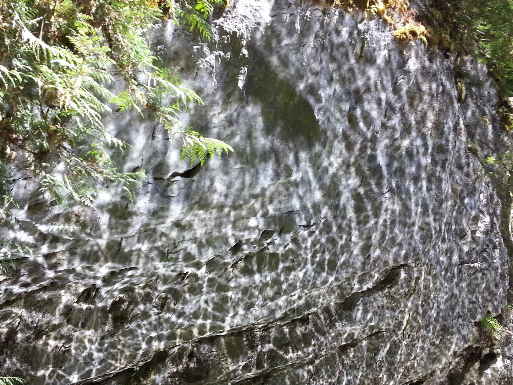 Rippling reflections on rock walls